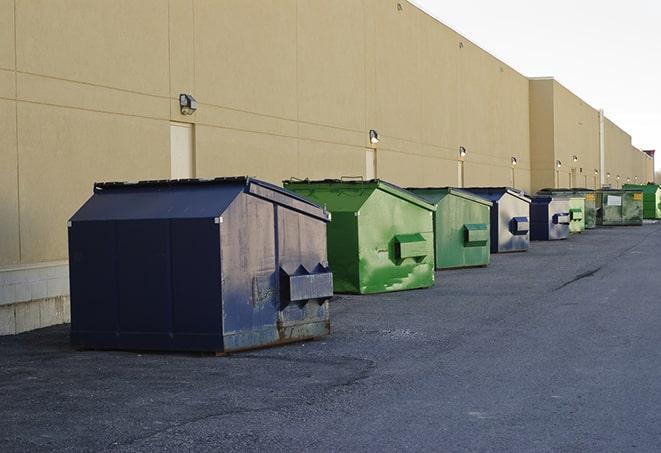 a row of industrial dumpsters at a construction site in Middletown